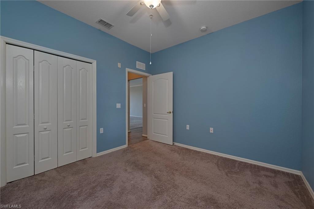 8550 Kingbird Loop, Unit 646 Estero, FL 33967 - Photo 16 of 23 an empty room with closet area