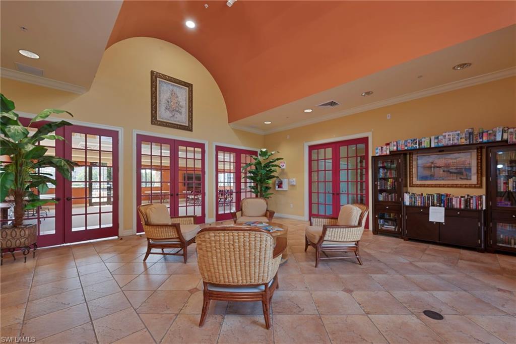 8550 Kingbird Loop, Unit 646 Estero, FL 33967 - Photo 21 of 23 a living room with furniture and chandelier