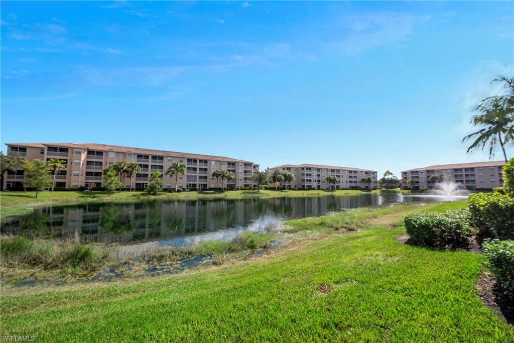 8550 Kingbird Loop, Unit 646 Estero, FL 33967 - Photo 4 of 23 a view of a lake with houses in the back