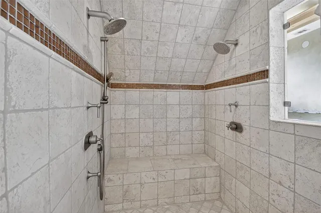 a spacious bathroom with a granite countertop sink and a mirror