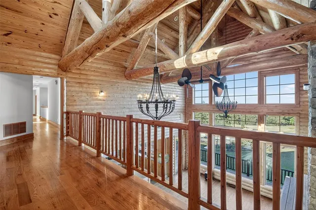 a view of a room with wooden floor