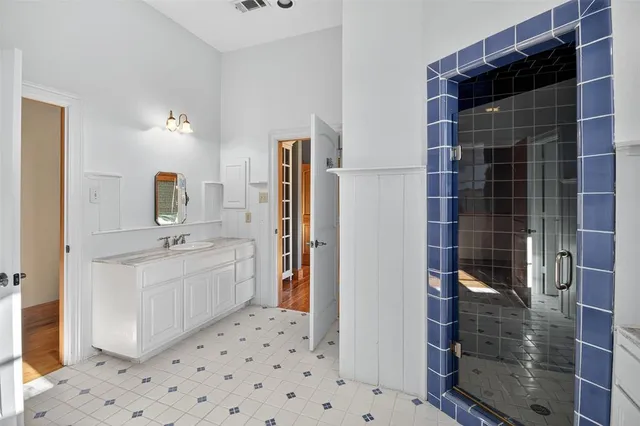 a bathroom with a sink a toilet and mirror