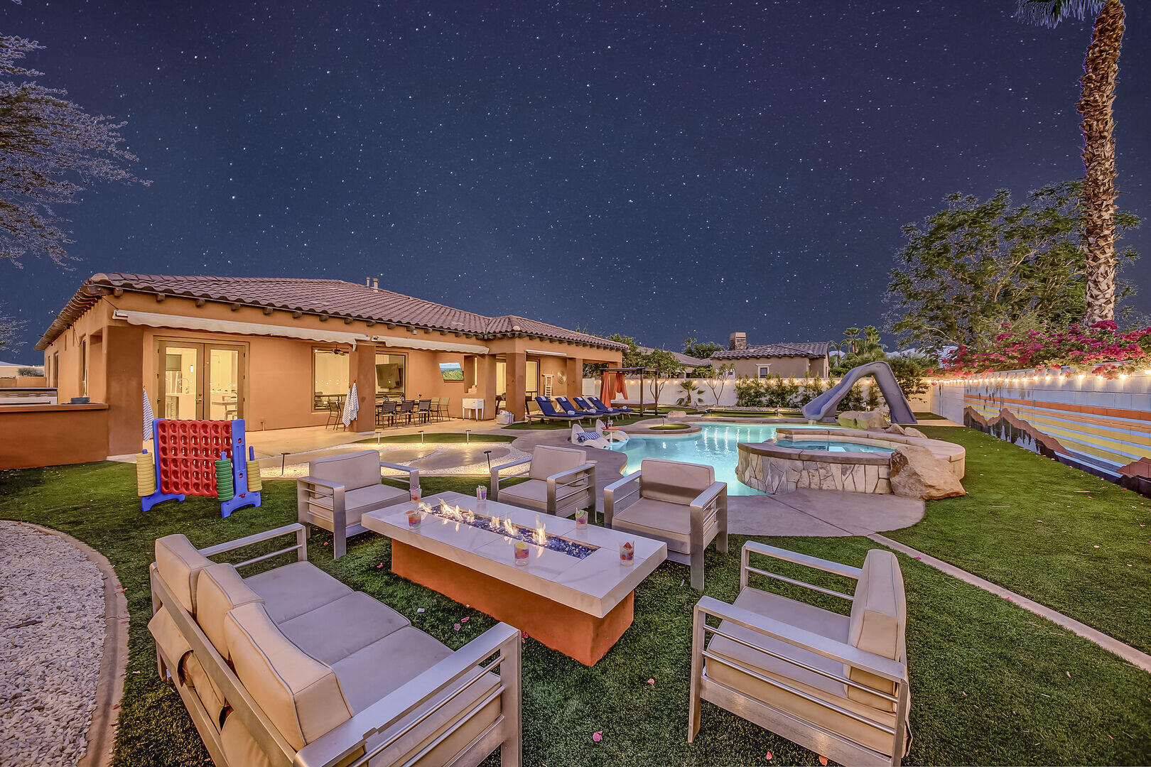 48573 Cascade Street Indio, CA 92201 - Photo 1 of 40 a aerial view of a house with swimming pool and outdoor seating