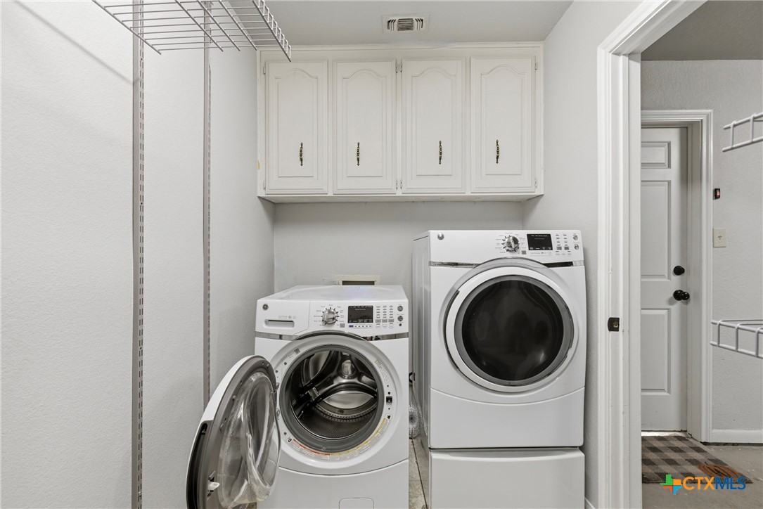 1710 Old Mill Road, Unit 12 Salado, TX 76571 - Photo 35 of 42 a utility room with dryer and washer