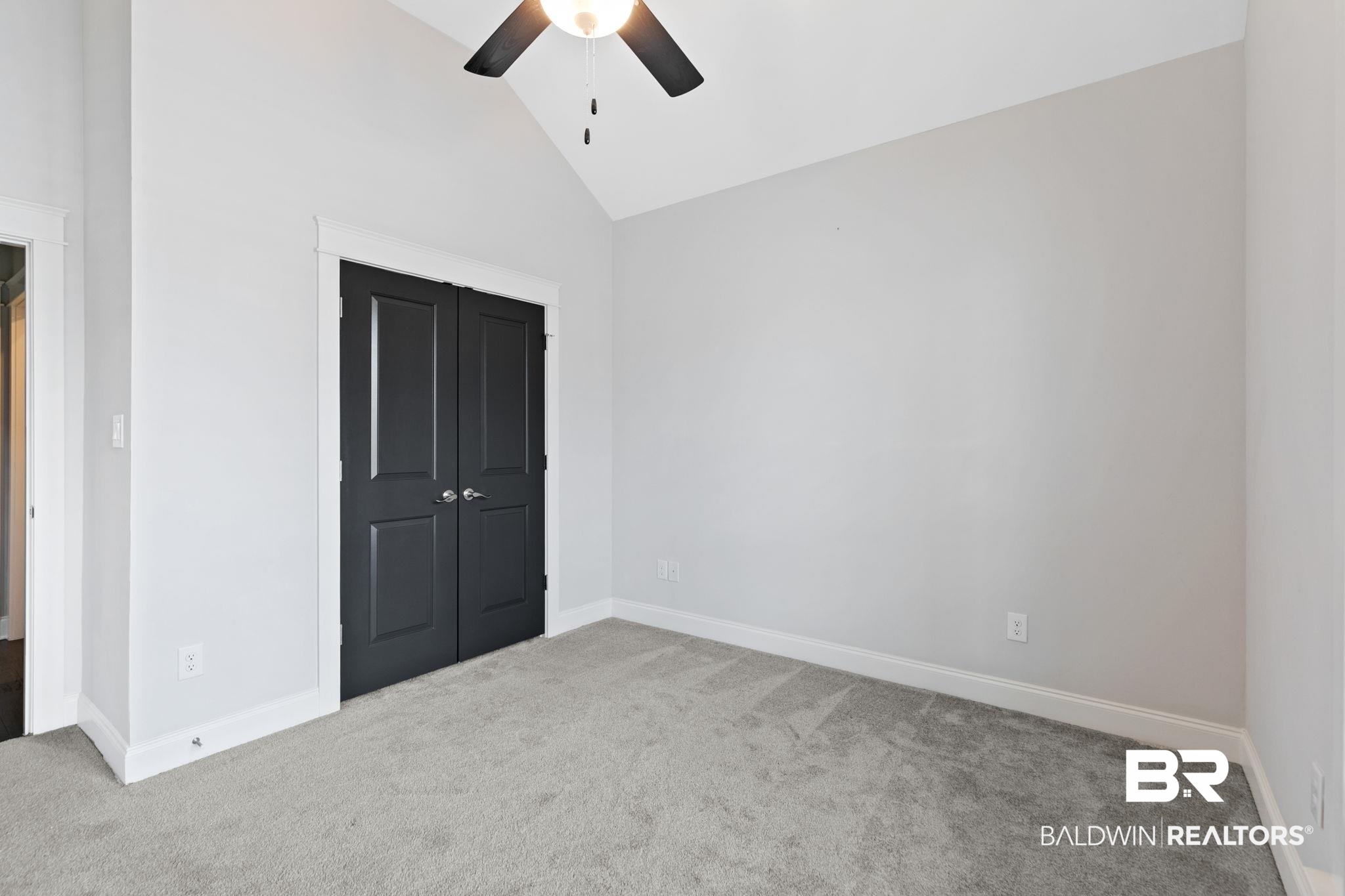 31654 Canopy Loop Daphne, AL 36527 - Photo 38 of 64 Unfurnished bedroom featuring carpet flooring, lofted ceiling, a closet, and a ceiling fan
