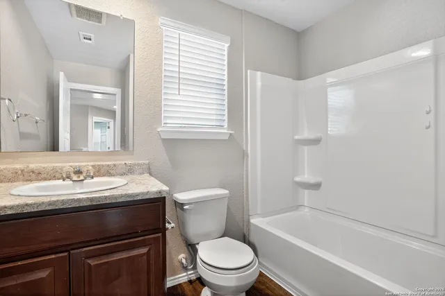 a bathroom with a sink a toilet and a bathtub