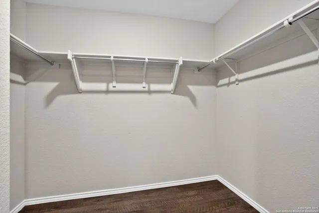 a view of an empty walk in closet