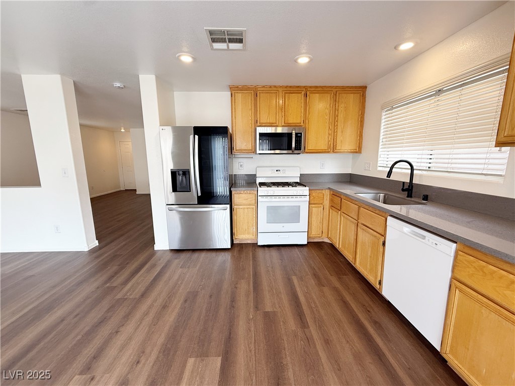 6228 Mercer Valley Street North Las Vegas, NV 89081 - Photo 13 of 41 Kitchen with stainless steel appliances, dark wood-style floors, and recessed lighting