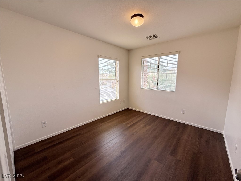6228 Mercer Valley Street North Las Vegas, NV 89081 - Photo 19 of 41 Unfurnished room with dark wood-style floors and baseboards
