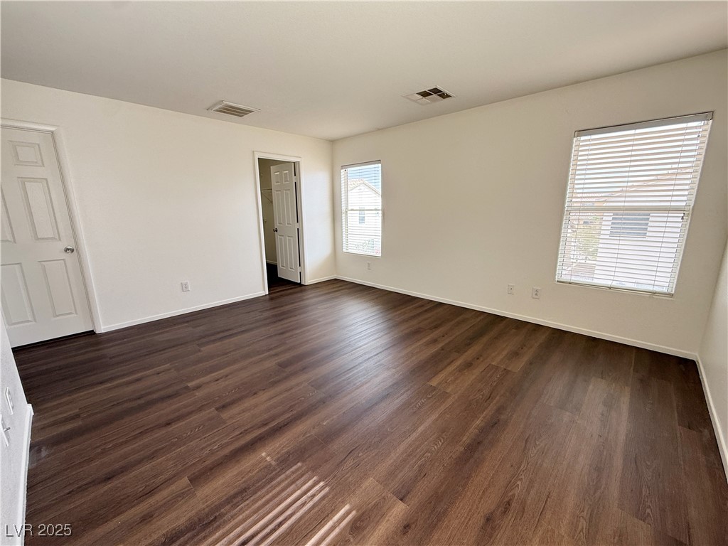 6228 Mercer Valley Street North Las Vegas, NV 89081 - Photo 35 of 41 Unfurnished bedroom with dark wood-type flooring