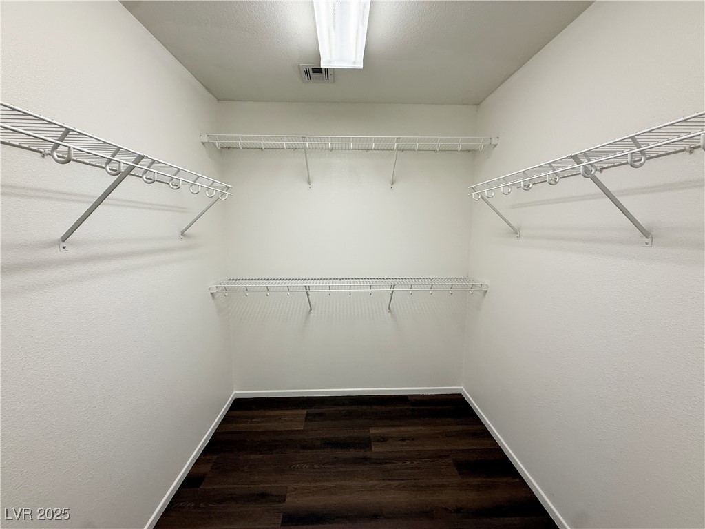 6228 Mercer Valley Street North Las Vegas, NV 89081 - Photo 36 of 41 Walk in closet with dark wood finished floors
