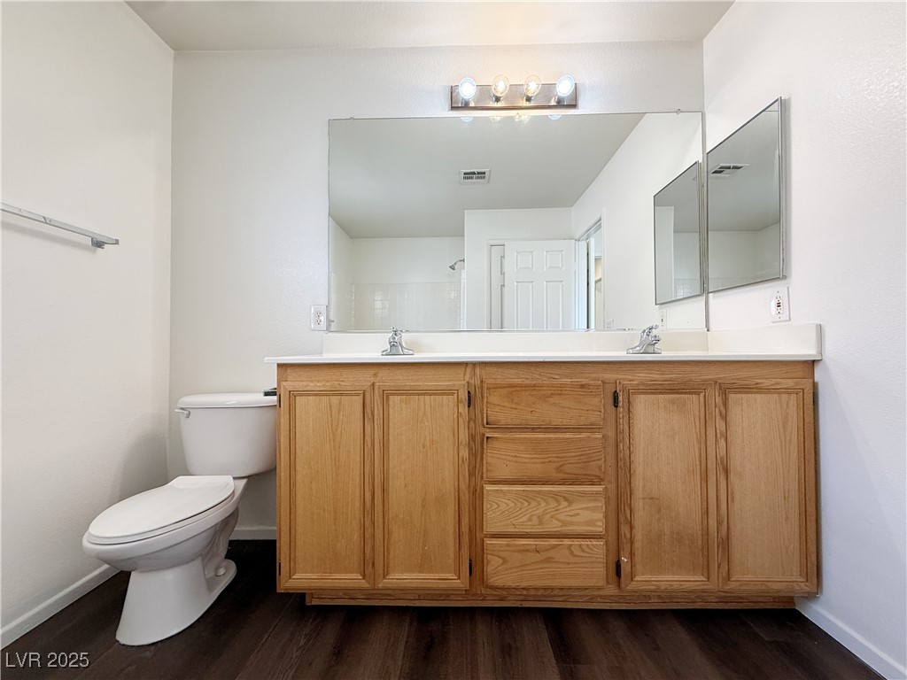 6228 Mercer Valley Street North Las Vegas, NV 89081 - Photo 37 of 41 Full bath with double vanity and dark wood finished floors