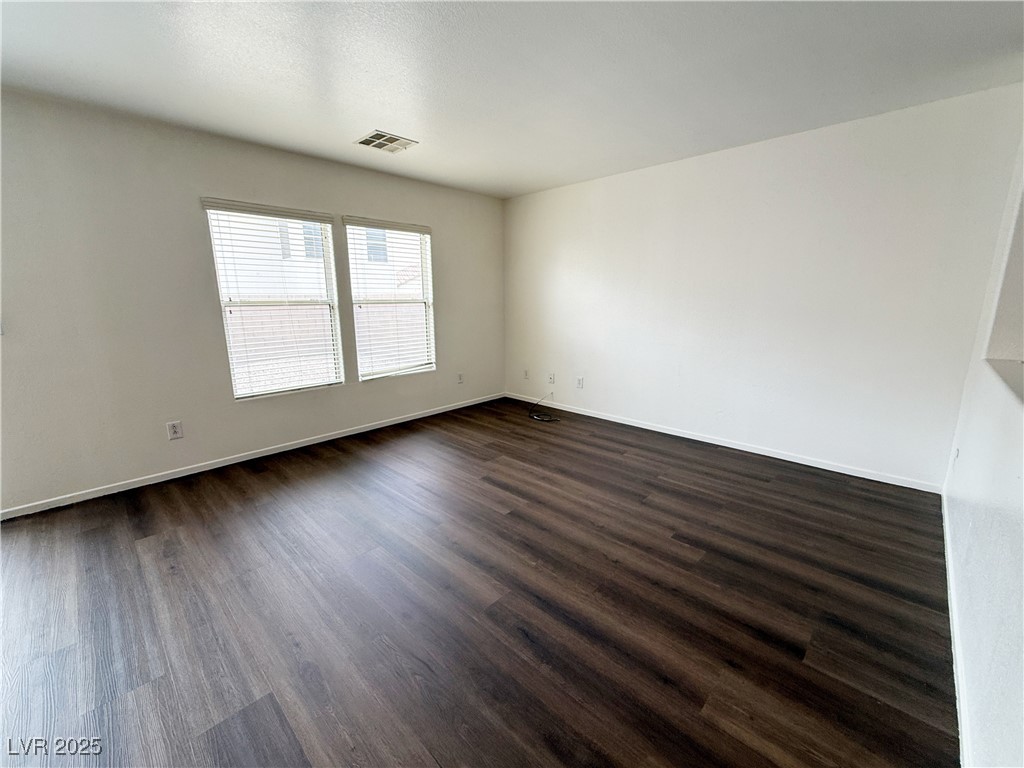 6228 Mercer Valley Street North Las Vegas, NV 89081 - Photo 10 of 41 Unfurnished room with dark wood-type flooring and baseboards