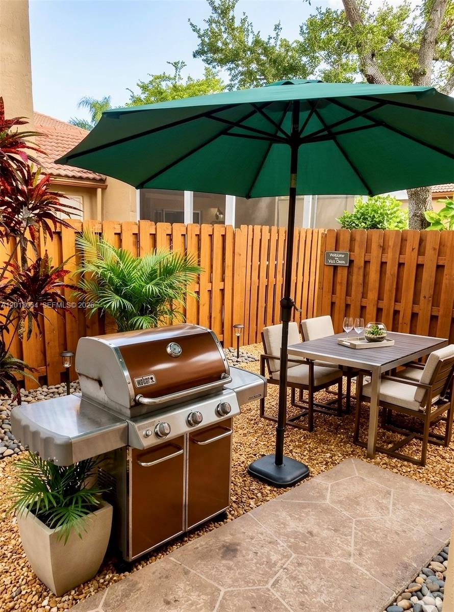 16213 Emerald Cove Road Weston, FL 33331 - Photo 21 of 27 a patio view with a seating space