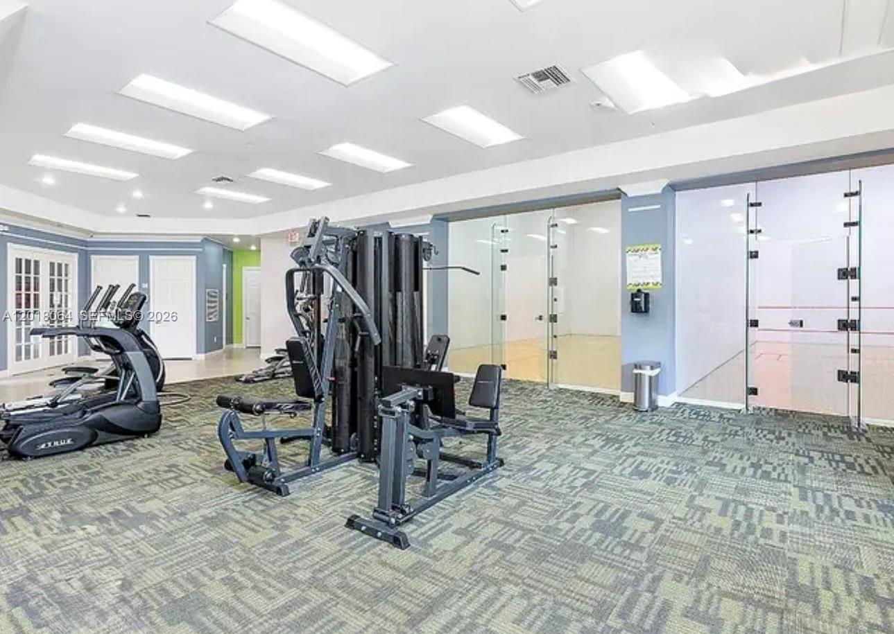 16213 Emerald Cove Road Weston, FL 33331 - Photo 26 of 27 a view of a room with gym equipment