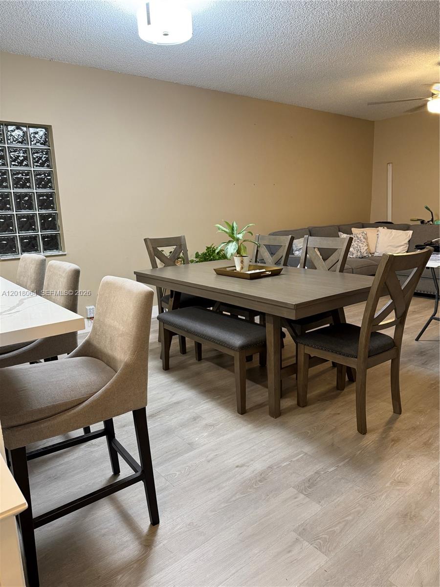 16213 Emerald Cove Road Weston, FL 33331 - Photo 4 of 27 a view of a dining room with furniture