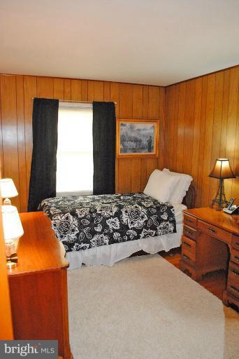 9523 Holiday Manor Road Baltimore, MD 21236 - Photo 14 of 30 a bedroom with bed and window