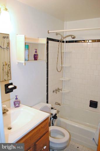 9523 Holiday Manor Road Baltimore, MD 21236 - Photo 22 of 30 a bathroom with a sink toilet and shower