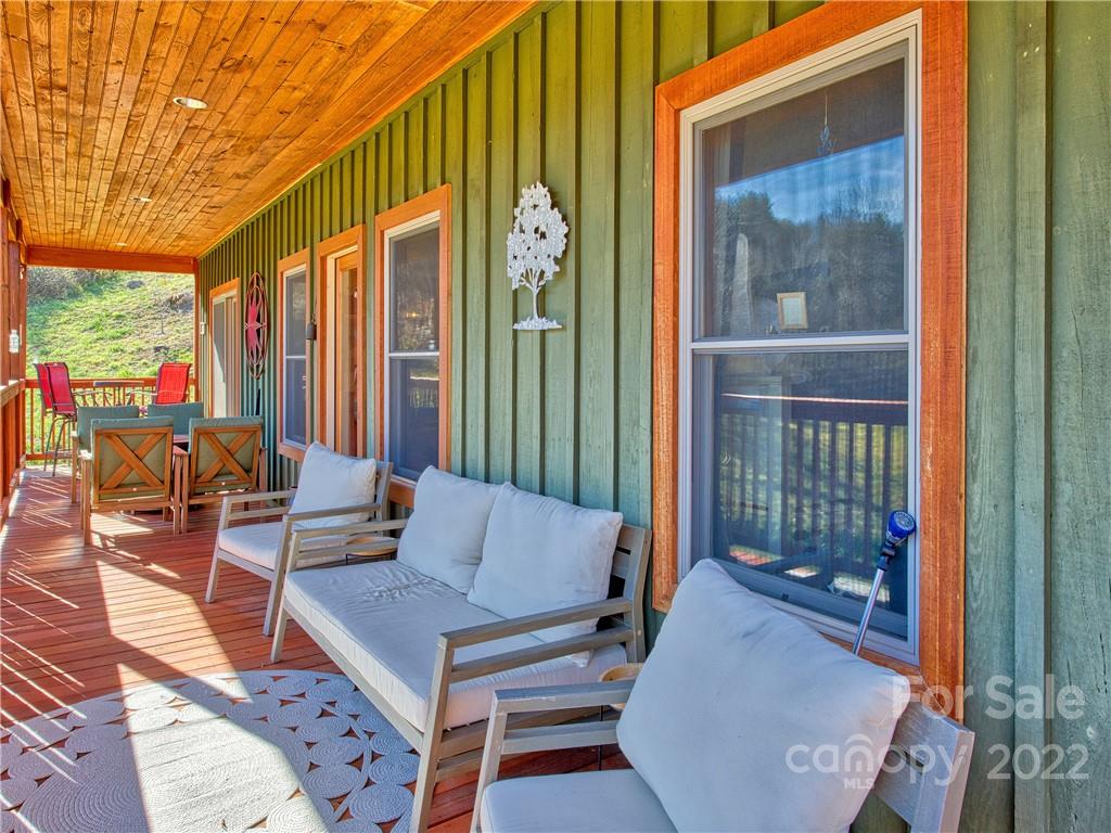 879 Lost Cove Road Clyde, NC 28721 - Photo 8 of 42 a building outdoor space with patio furniture