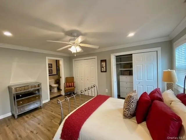 a bedroom with a bed and a couch