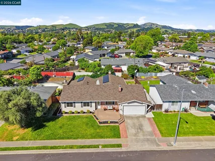 an aerial view of a house with a swimming pool