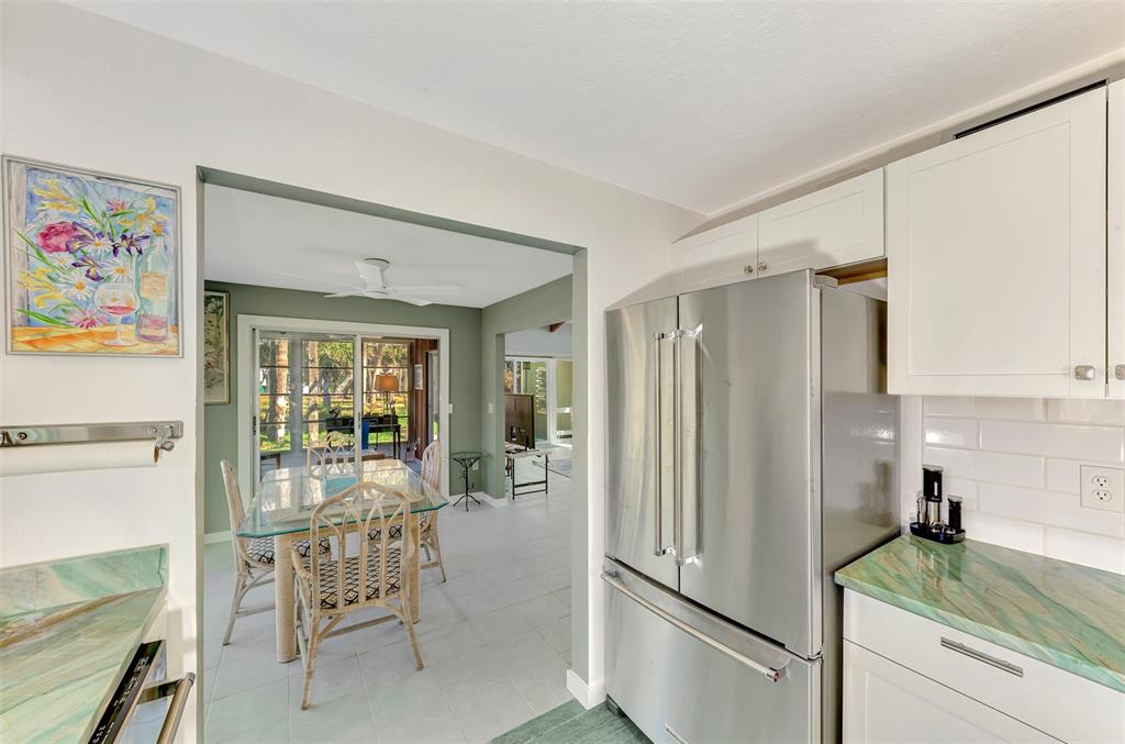 2985 North Beach Road, Unit C53 Englewood, FL 34223 - Photo 12 of 67 a kitchen with refrigerator and window
