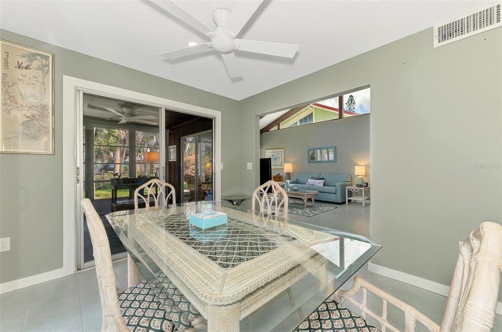 2985 North Beach Road, Unit C53 Englewood, FL 34223 - Photo 16 of 67 a view of a dining room with furniture