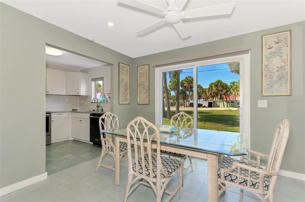 2985 North Beach Road, Unit C53 Englewood, FL 34223 - Photo 17 of 67 a view of a dining room with furniture window and outside view