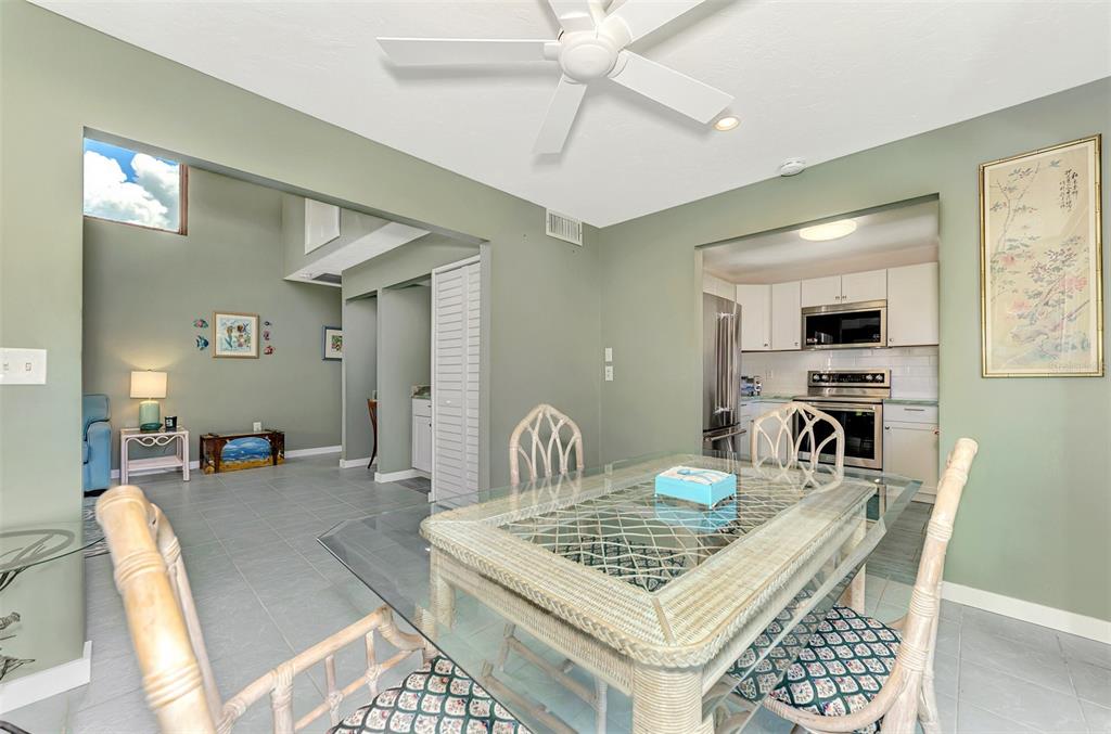 2985 North Beach Road, Unit C53 Englewood, FL 34223 - Photo 19 of 67 a view of a dining room with furniture