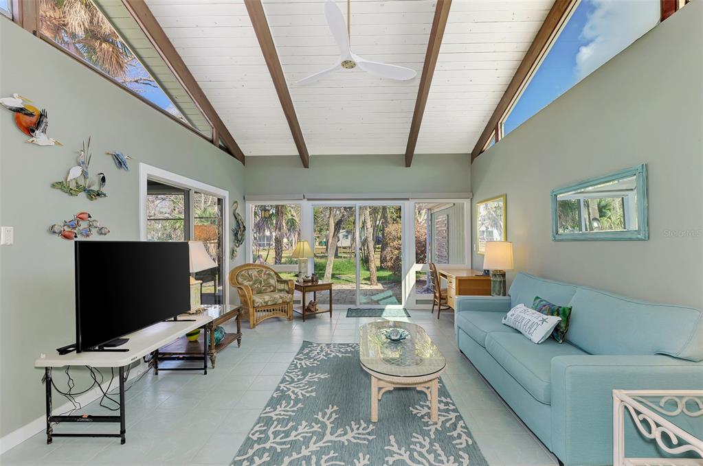 2985 North Beach Road, Unit C53 Englewood, FL 34223 - Photo 21 of 67 a living room with furniture and a flat screen tv