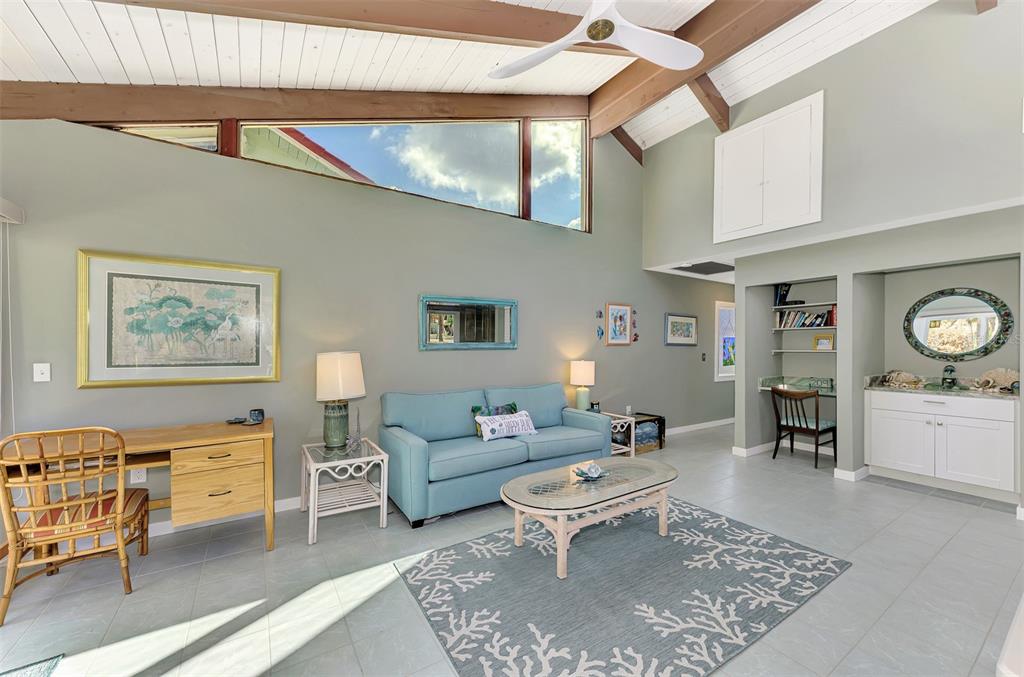 2985 North Beach Road, Unit C53 Englewood, FL 34223 - Photo 22 of 67 a living room with furniture and wooden floor