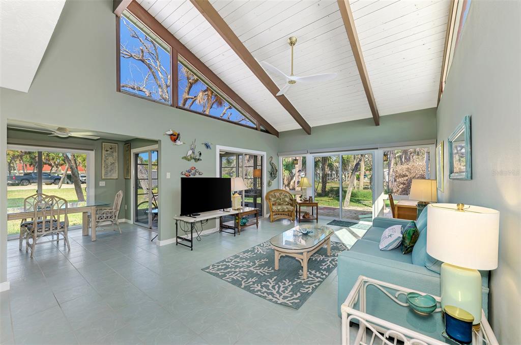 2985 North Beach Road, Unit C53 Englewood, FL 34223 - Photo 23 of 67 a living room with furniture and a flat screen tv