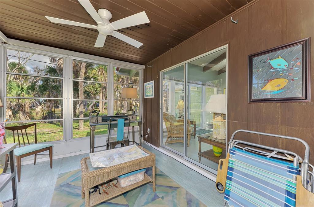 2985 North Beach Road, Unit C53 Englewood, FL 34223 - Photo 27 of 67 a room with pool table and glass windows