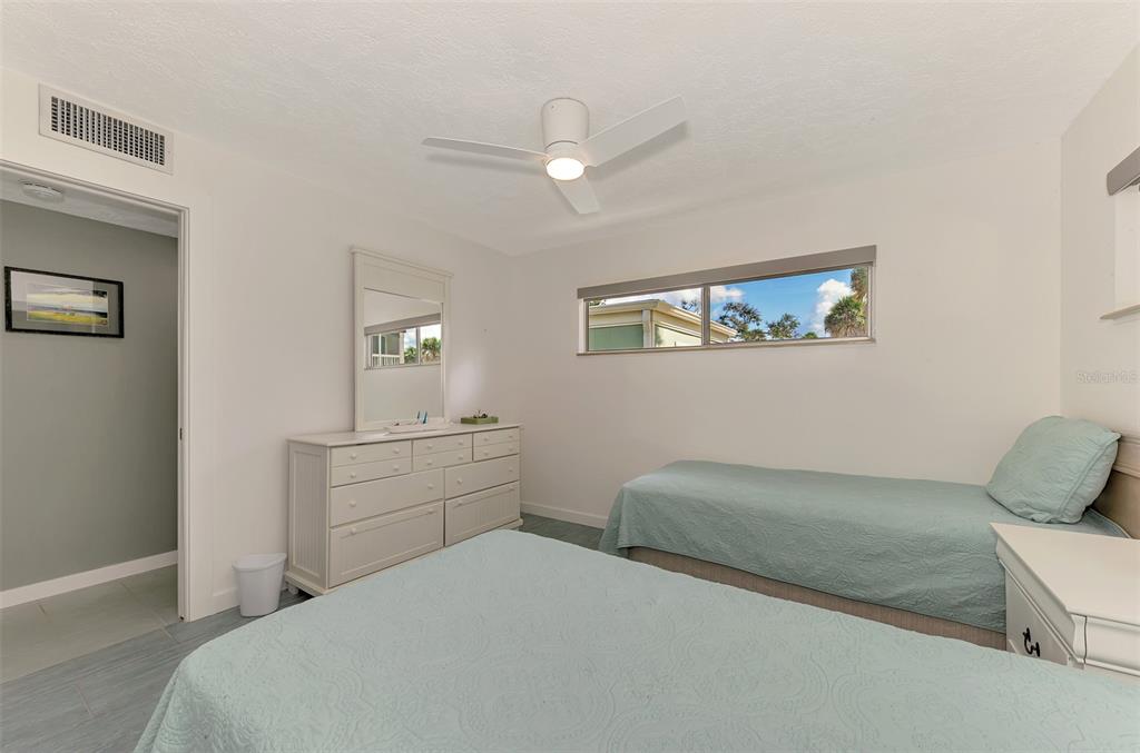 2985 North Beach Road, Unit C53 Englewood, FL 34223 - Photo 33 of 67 a room with a bed and a window