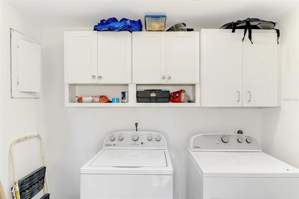 2985 North Beach Road, Unit C53 Englewood, FL 34223 - Photo 36 of 67 a utility room with dryer and washer
