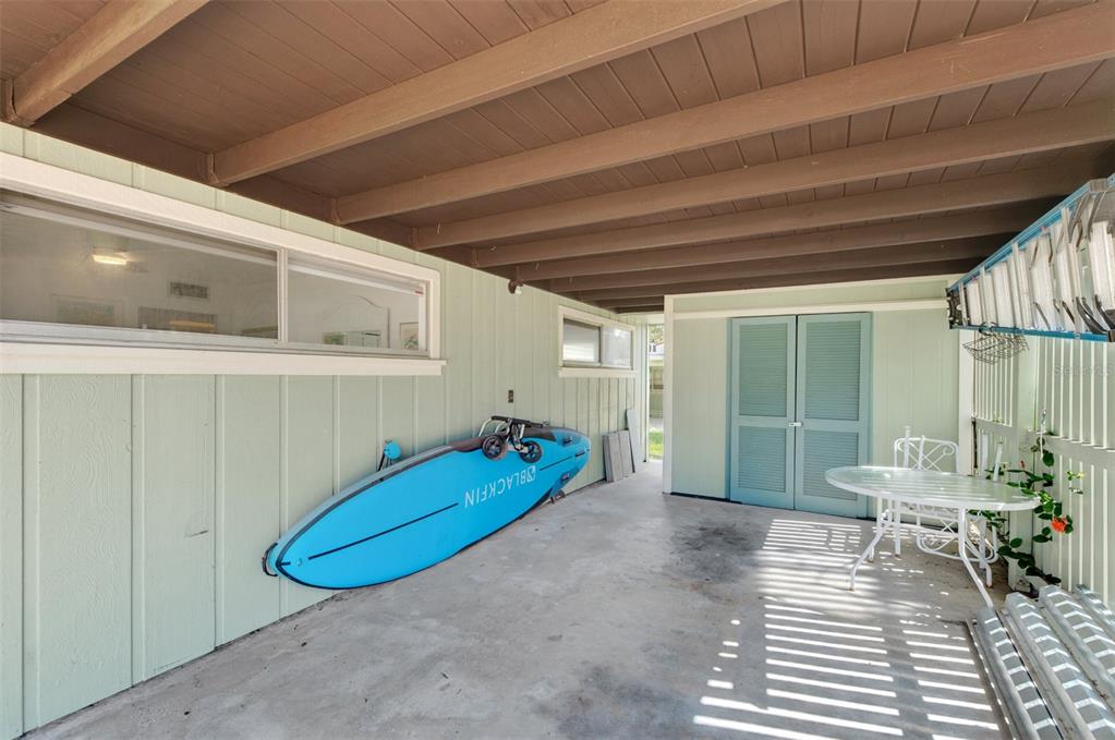 2985 North Beach Road, Unit C53 Englewood, FL 34223 - Photo 40 of 67 a view of a room with wooden floor and chair