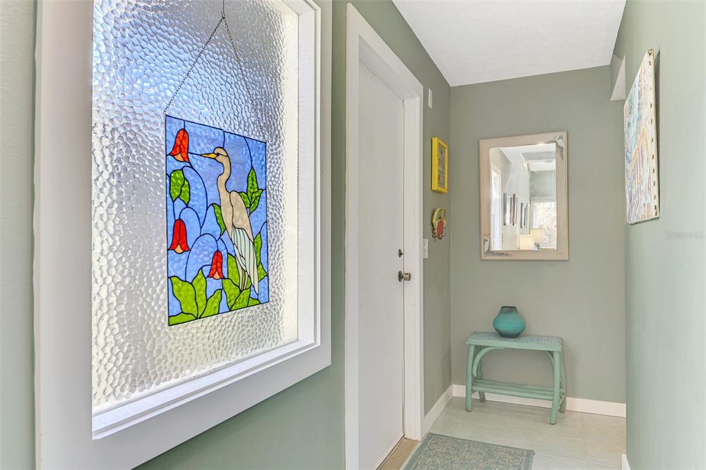 2985 North Beach Road, Unit C53 Englewood, FL 34223 - Photo 7 of 67 a room with painting on the wall and a window