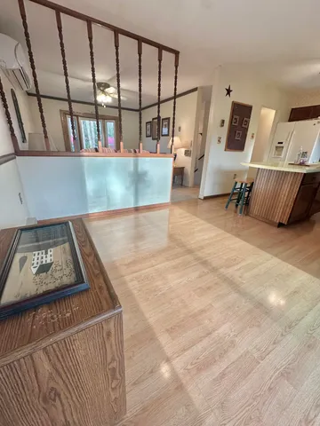 a view of a hallway view with staircase