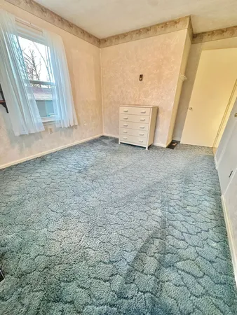 a living room with a couch and a table in it