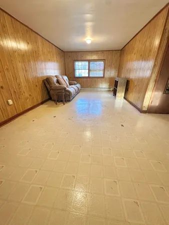 a view of a livingroom with furniture and window