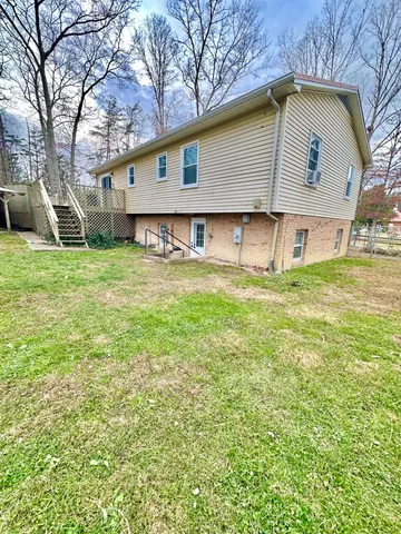 a view of a park with iron fence