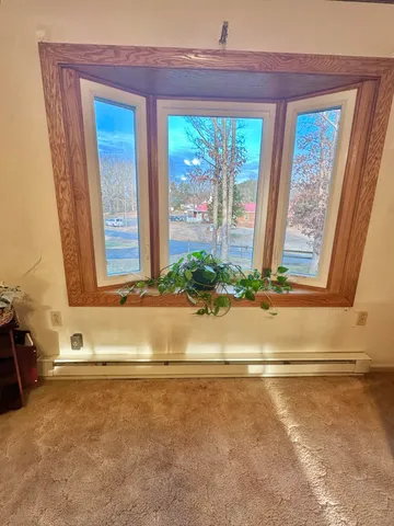 a kitchen with stainless steel appliances granite countertop a stove a sink dishwasher and a refrigerator with wooden floor