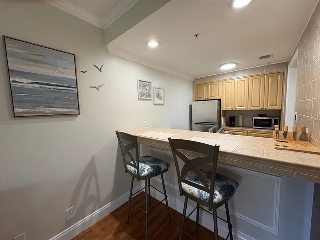 a kitchen with a table and chairs in it