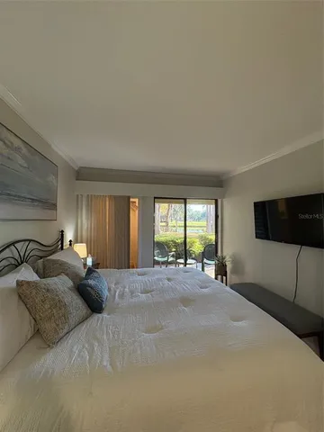 a view of a balcony with chairs and wooden floor