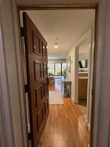 a view of a kitchen from the hallway