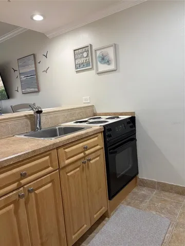 a view of a kitchen with microwave and cabinets