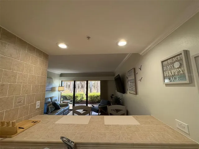 a room with gym equipment and a flat screen tv