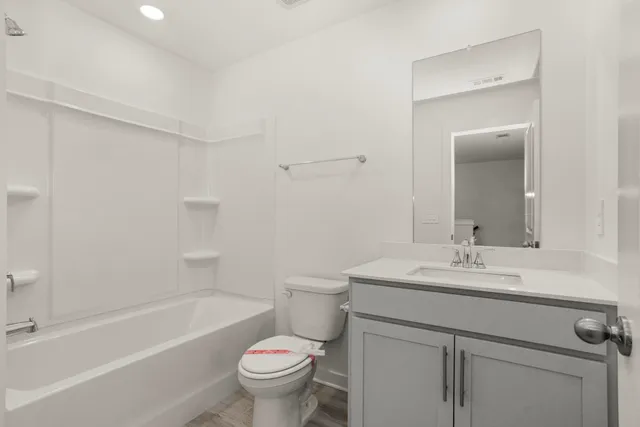 a bathroom with a sink toilet and bathtub