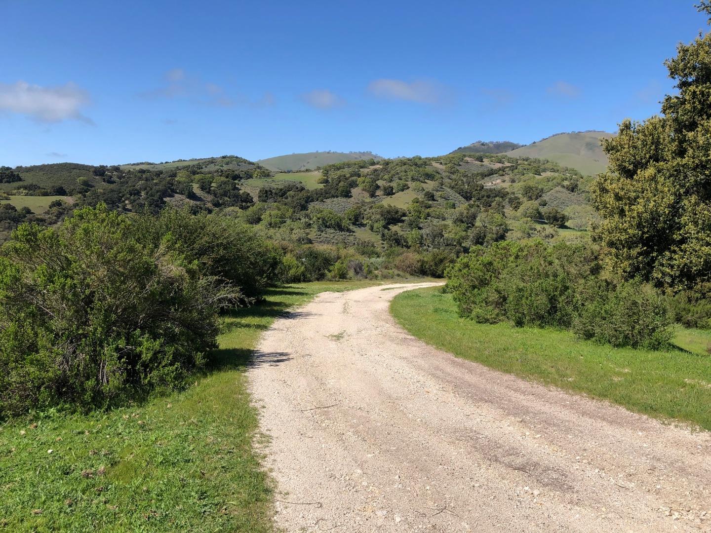 36000 East Carmel Valley Road Carmel Valley, CA 93924 - Photo 34 of 41 a view of a lake with a yard