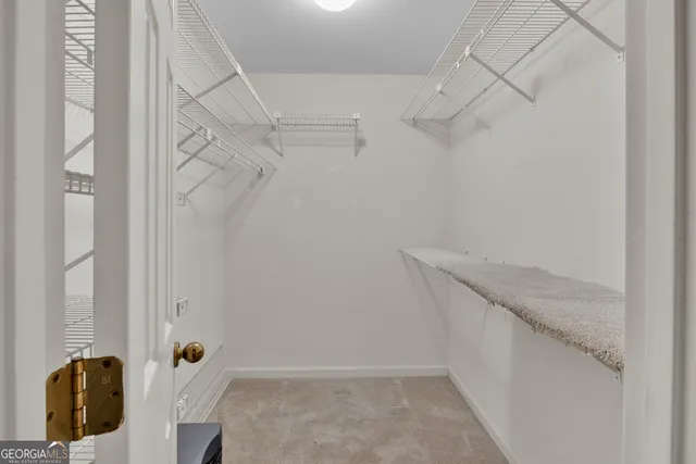 a bathroom with a tub a sink and a large mirror